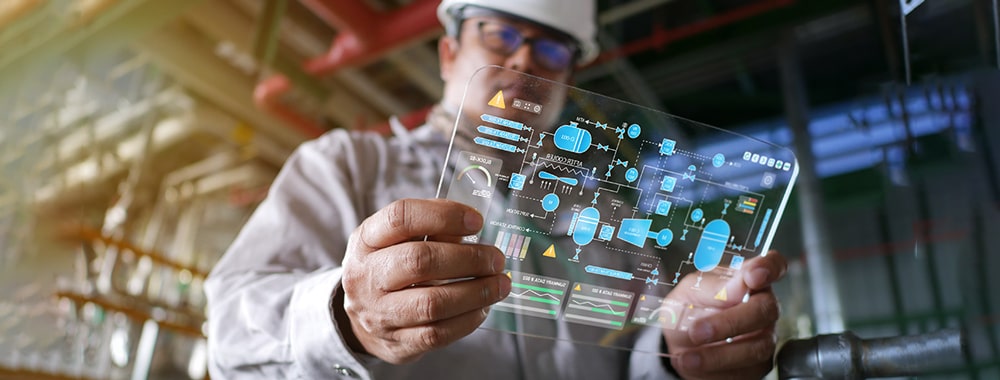 male-engineer-in-hardhat-with-viewing-piping-and-instrument-diagrams